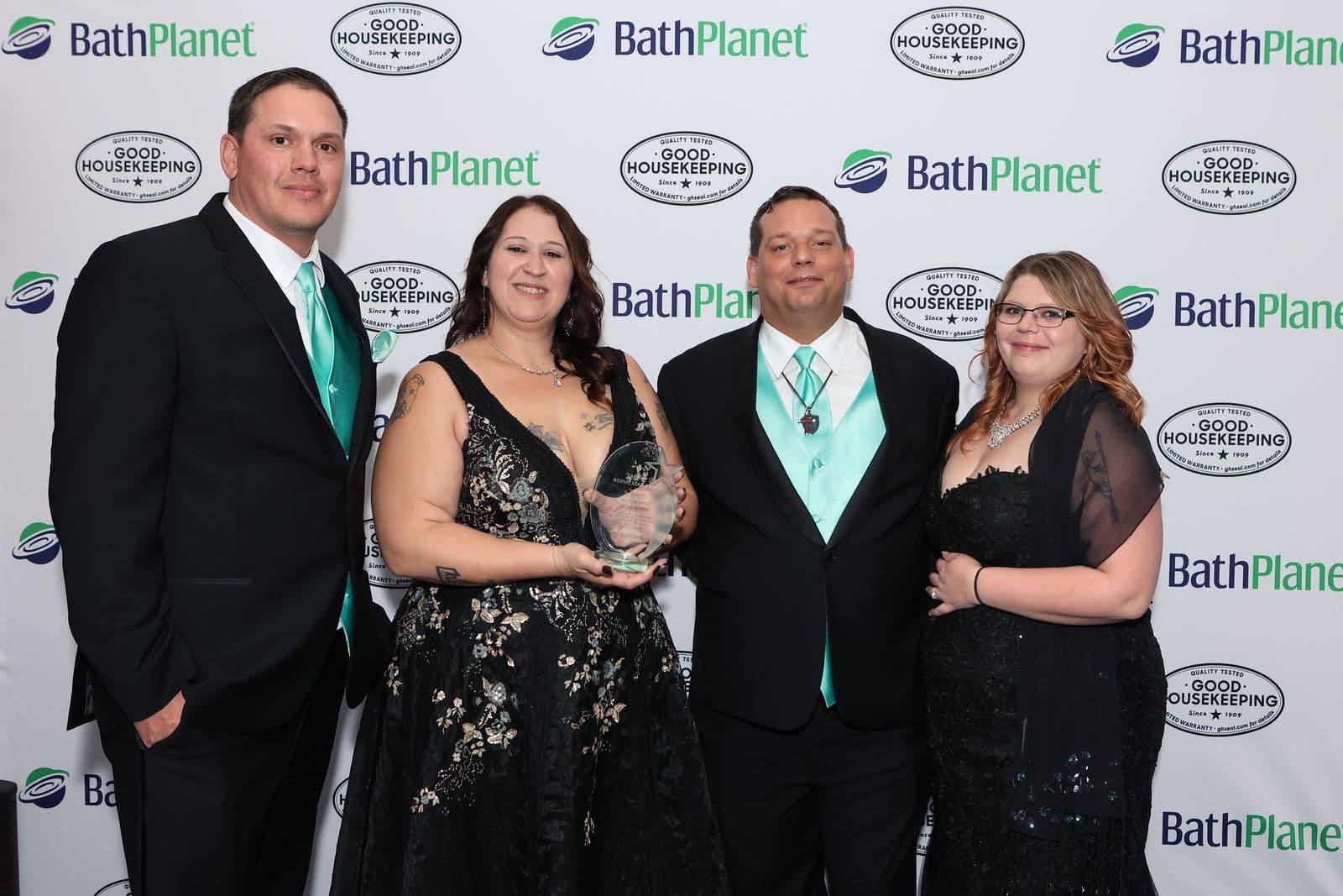 A photo of the Coastal Bath Co. team ad the Bath Planet Conference Awards.