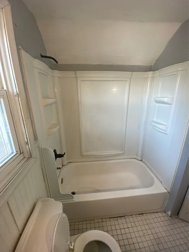 A combination alcove shower-tub.