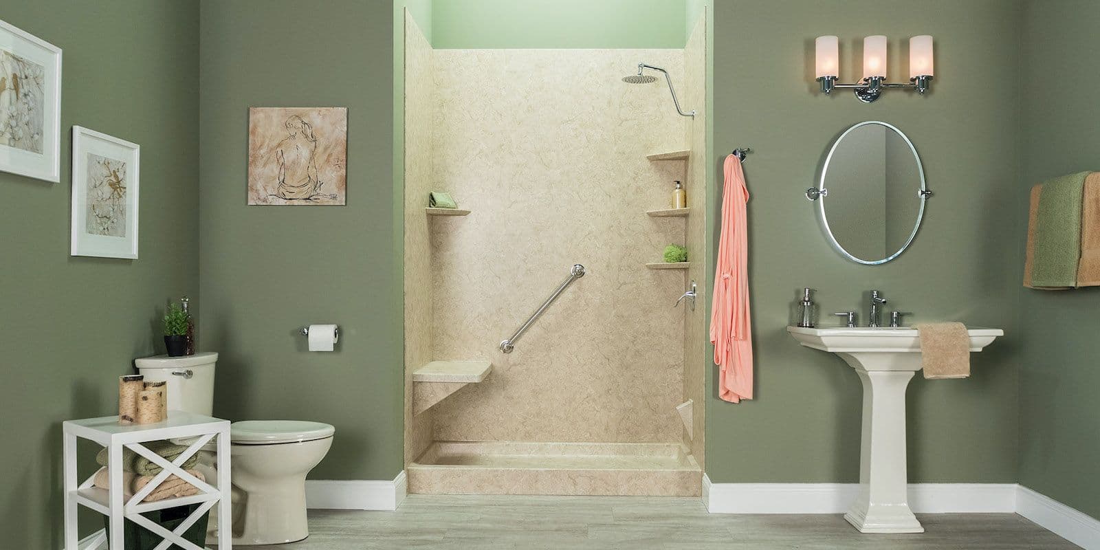 A green bathroom with a beige walk-in shower with corner shelves, built-in bench, and diagonal grab bar.