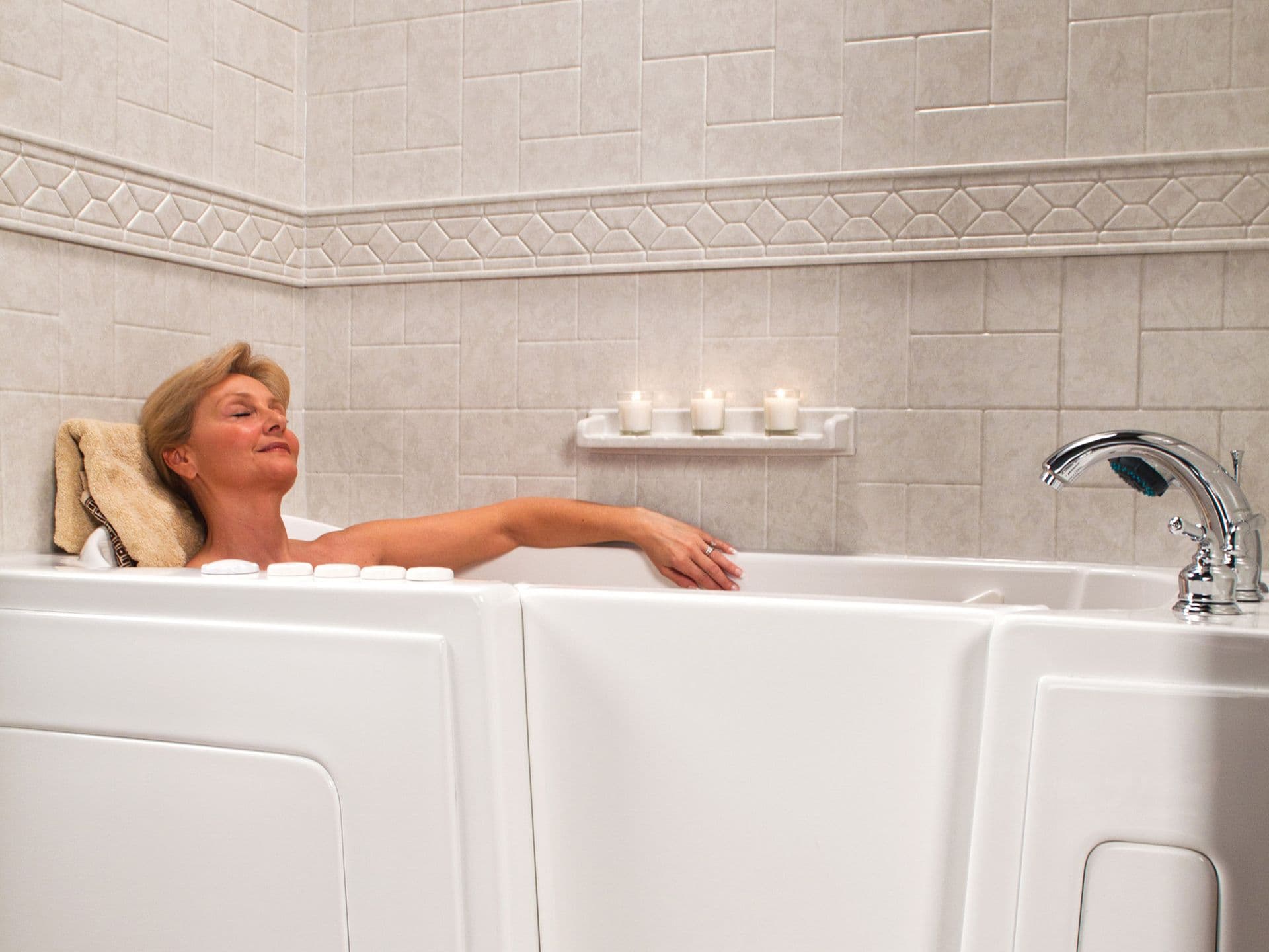 A person relaxes in an accessible walk-in bathtub.