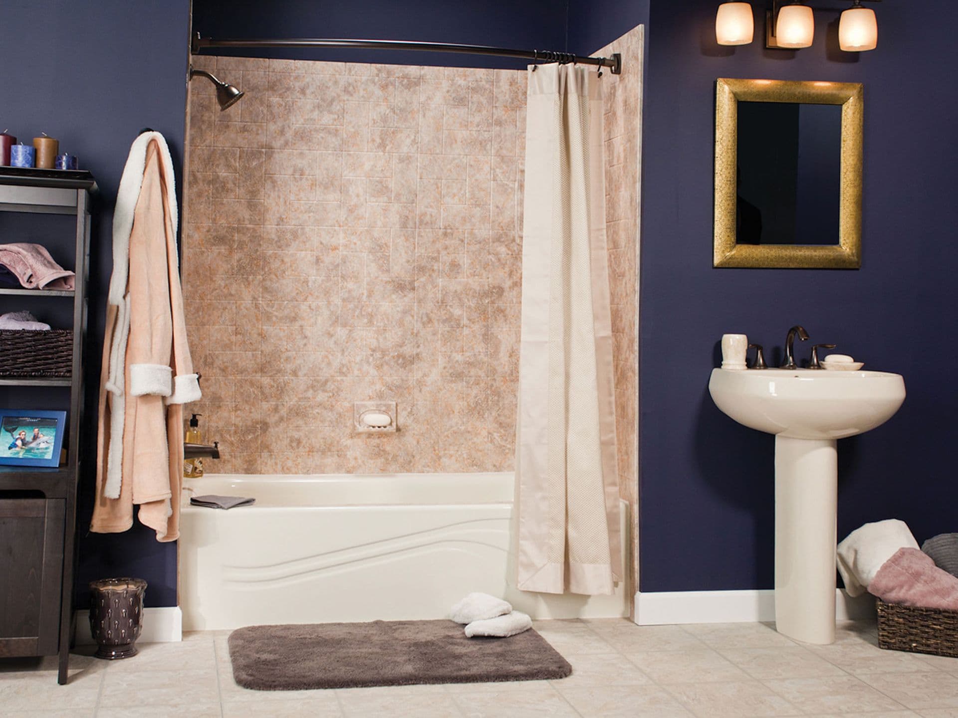 A navy blue bathroom with a combination shower tub with a curtain and beige tile patterned walls.