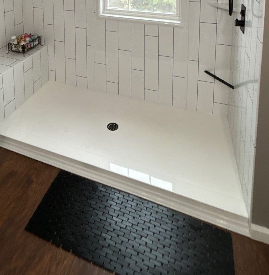 A close-up of a shower with a nonslip floor.