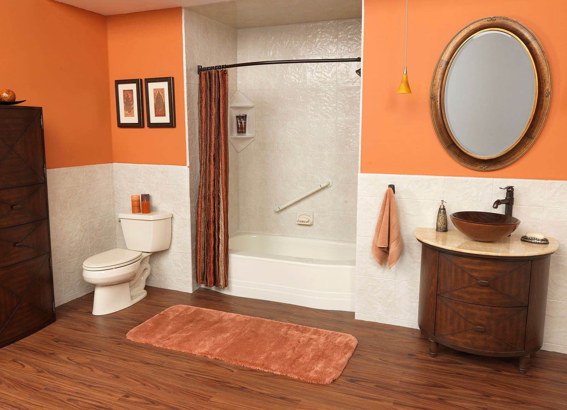 An orange and white bathroom with a combination shower tub with shower curtain, textured walls, and diagonal grab bar.