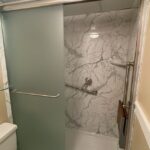 small bathroom with a sliding glass shower