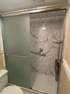 small bathroom with a sliding glass shower