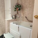 walk in tub installed in a small bathroom