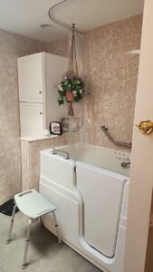 walk in tub installed in a small bathroom